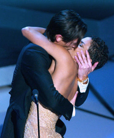 Winner of the Oscar for best actor Adrien Brody suprises presenter Halle Berry with a kiss, 75th annual Academy Awards, Los Angeles, March 23, 2003.